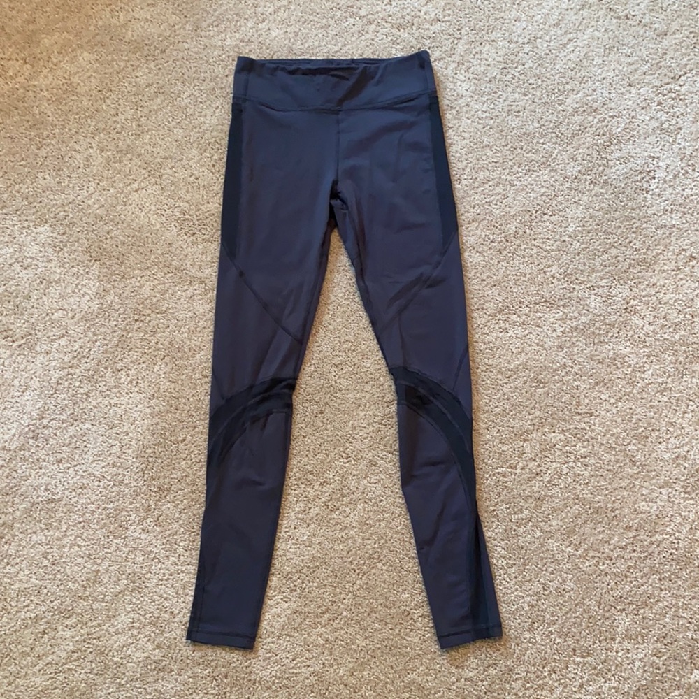 Ivivva, size 14, grey leggings with mesh cutouts.